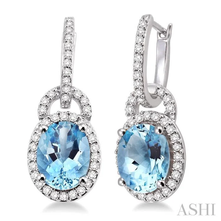 Women’s bridal earrings-9x7mm Oval Cut Aquamarine and 3/8 Ctw Round Cut Diamond Earrings in 14K White Gold