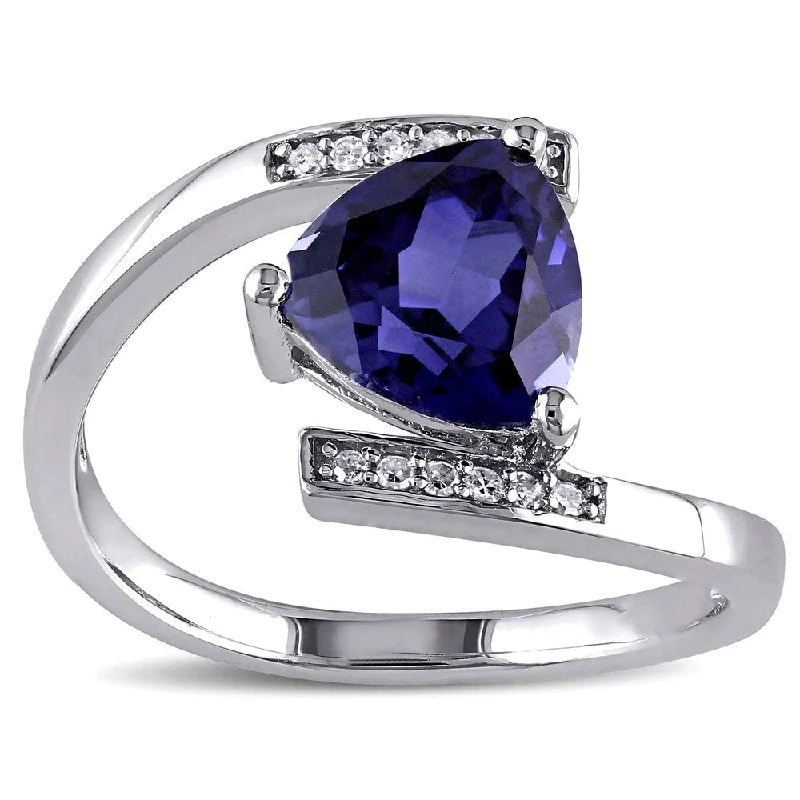 Women’s affordable engagement rings-Miadora Sterling Silver Created Blue Sapphire and Diamond Accent Bypass Ring