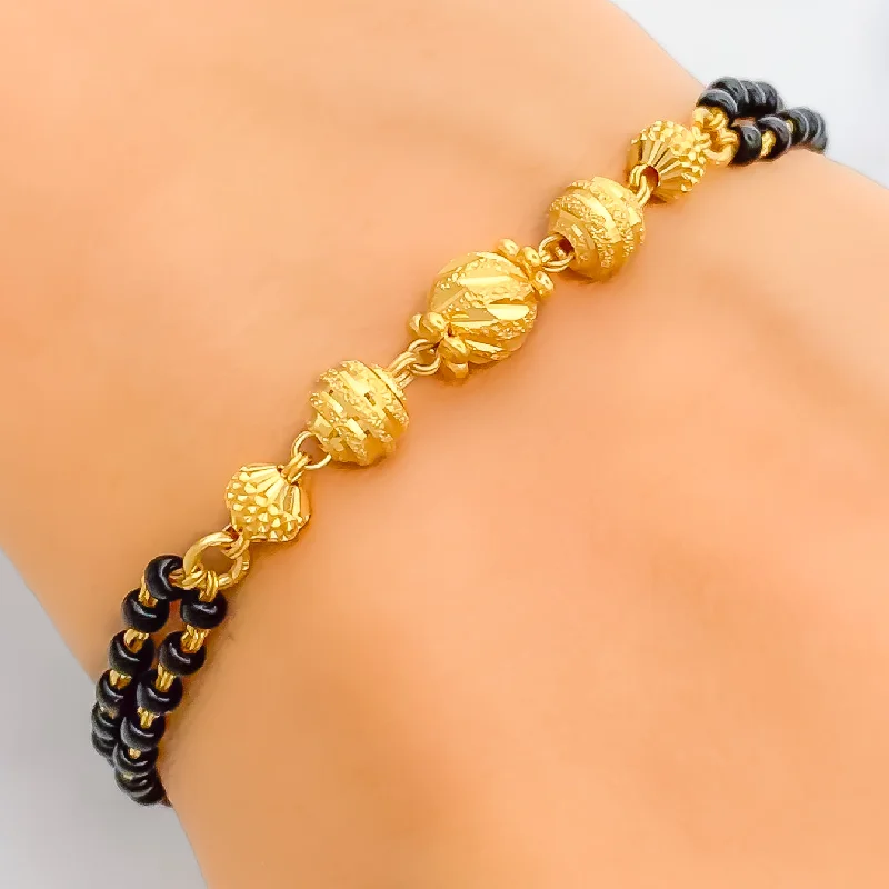 Women’s friendship bracelets-Lavish Textured 22k Gold Black Bead Bracelet