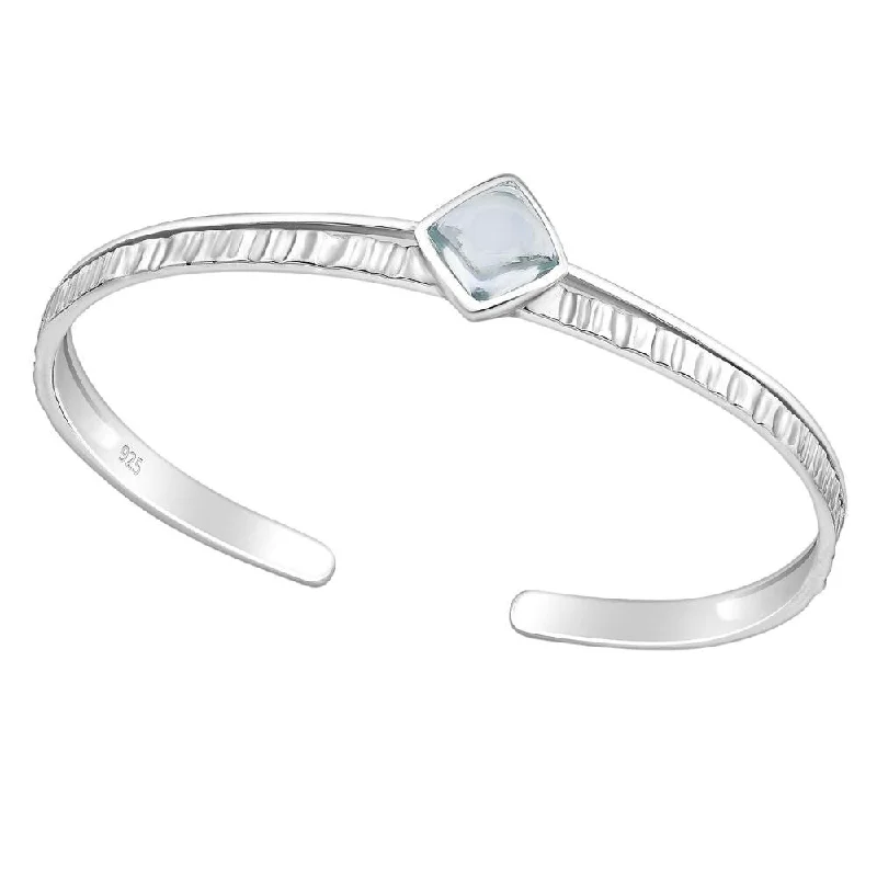 Women’s silver bracelets-Sterling Silver Textured Cuff Bracelet with Sky Blue Topaz