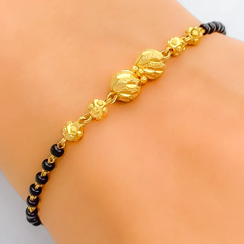 Women’s bangle bracelets-Upscale Twin Orb 22k Gold Black Bead Bracelet