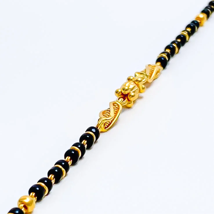 Women’s multi-colored bangles-Elongated Barrel 22k Gold Black Bead Baby Bracelet