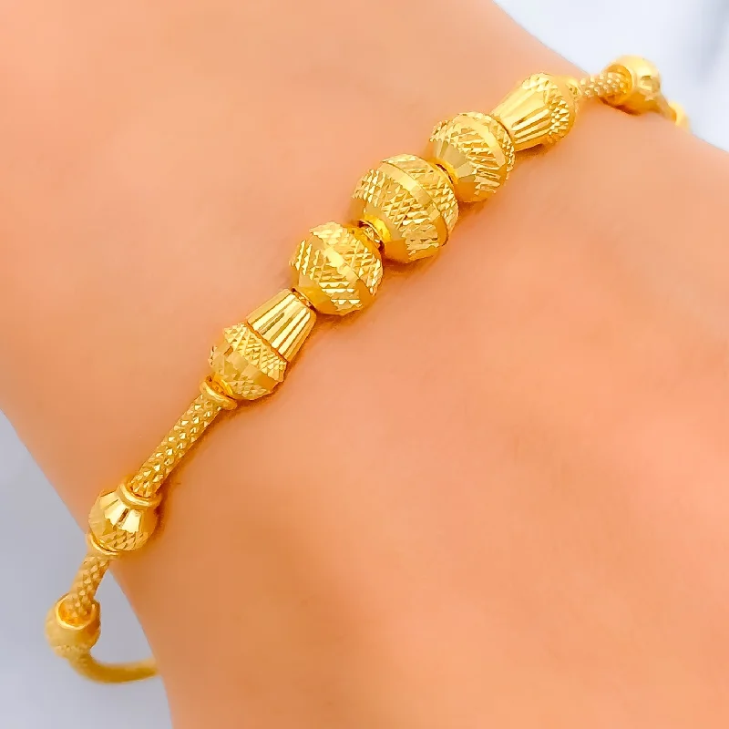 Women’s engraved cuff bracelets-Refined Faceted Orb 22k Gold Bangle Bracelet