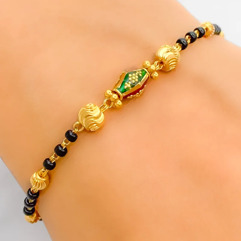 Women’s stackable bracelets-Vibrant Elongated Orb 22k Gold Black Bead Bracelet